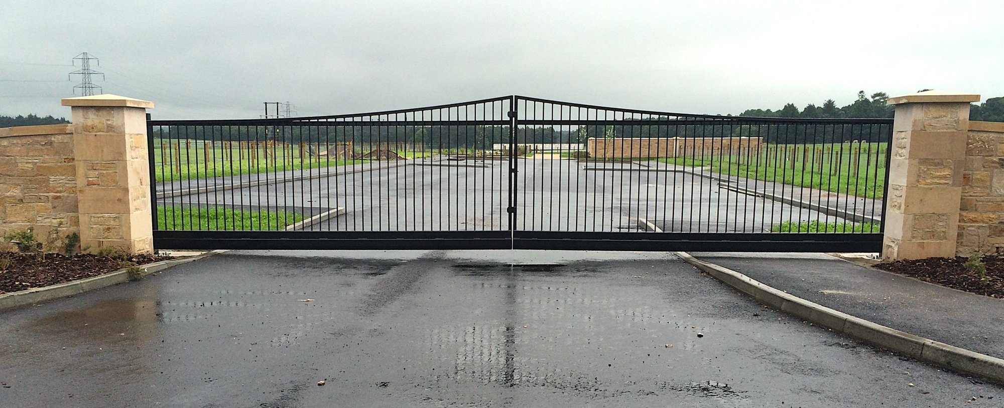 9.50m wide bi-parting cantilever gate to new cemetery. Gates galvanised and polyester powder coated.