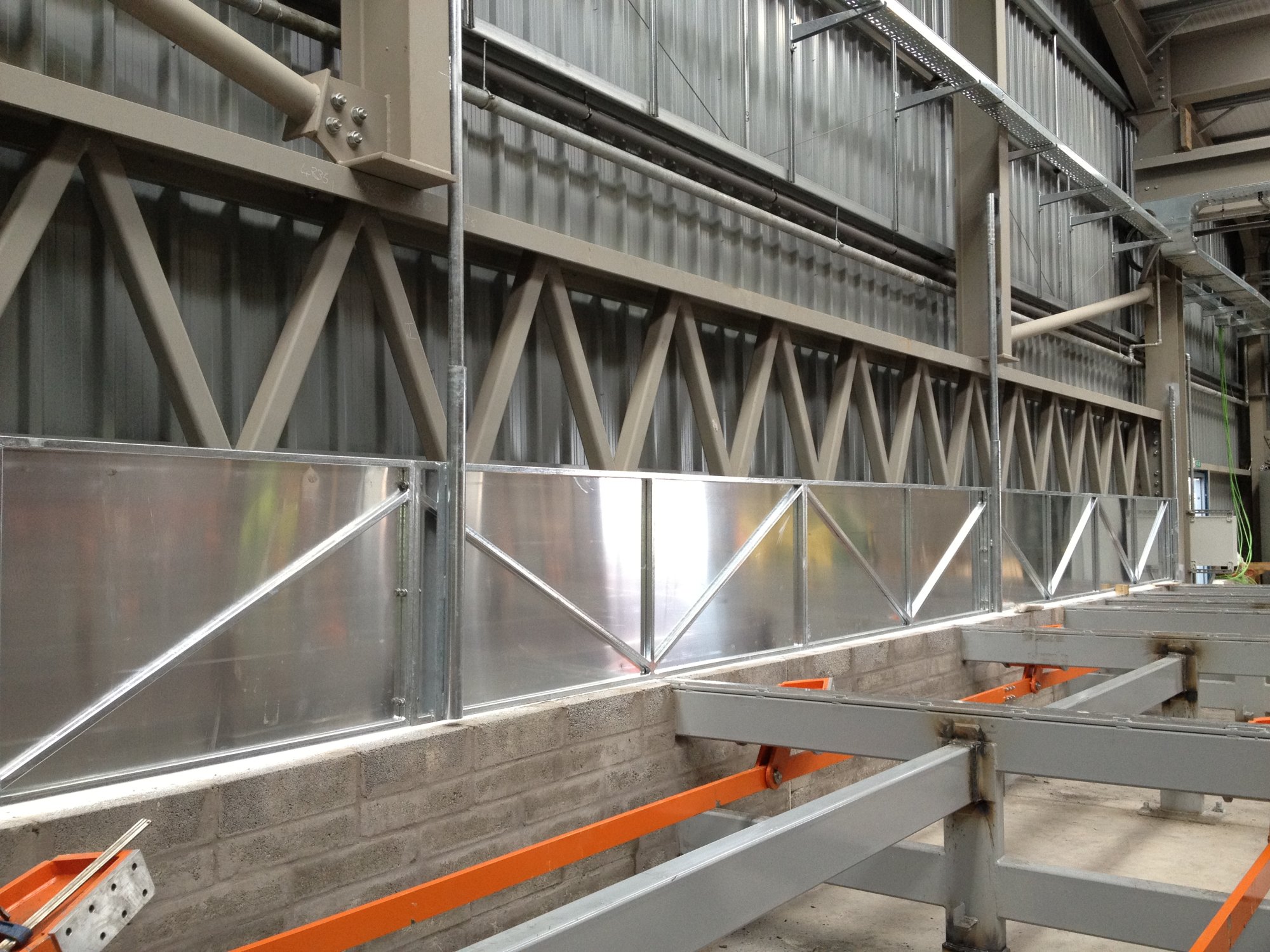 Rising doors to tubular production workshop.
