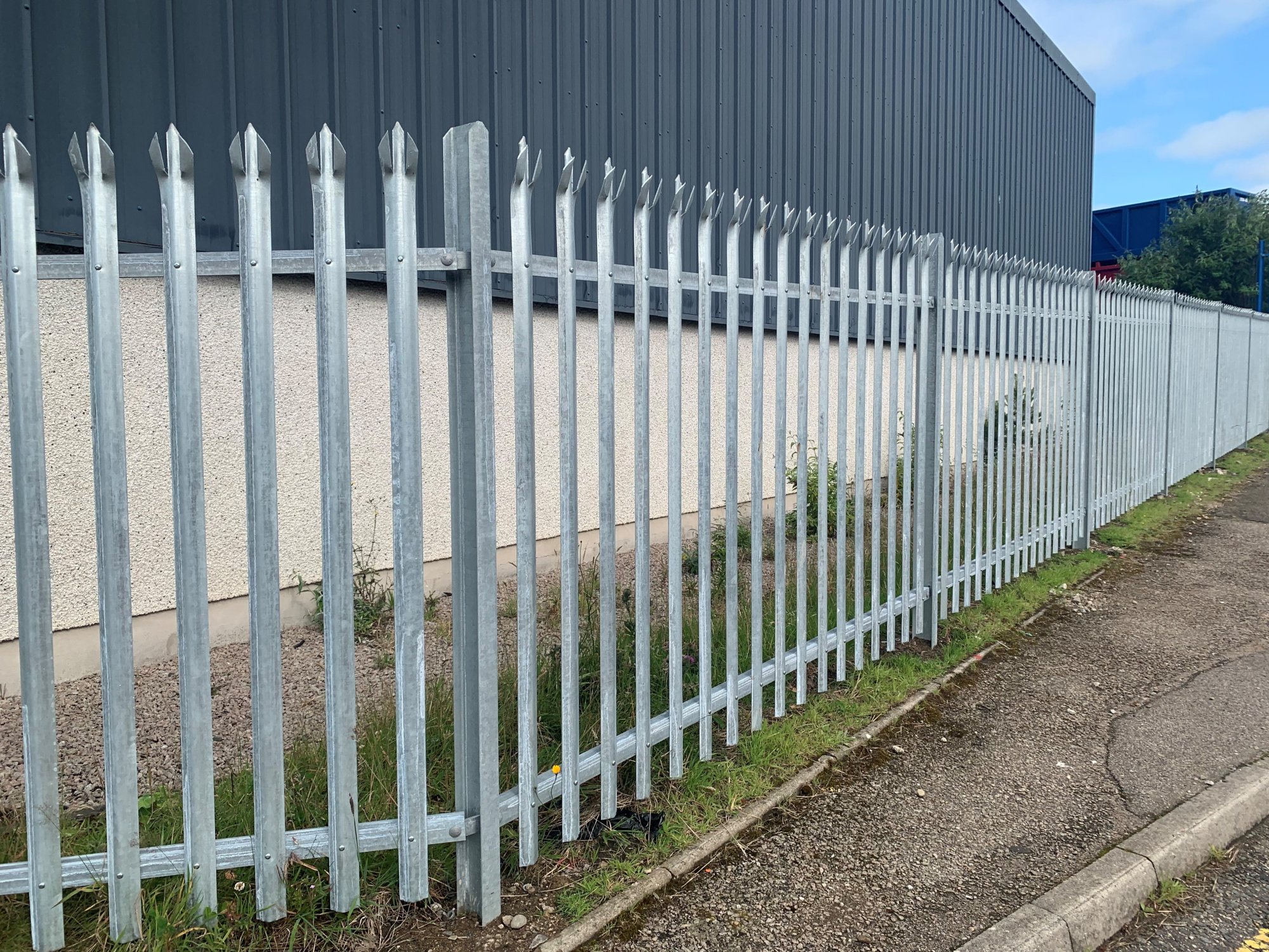 1800mm high galvanised 'D' section tri-point palisade fencing.
