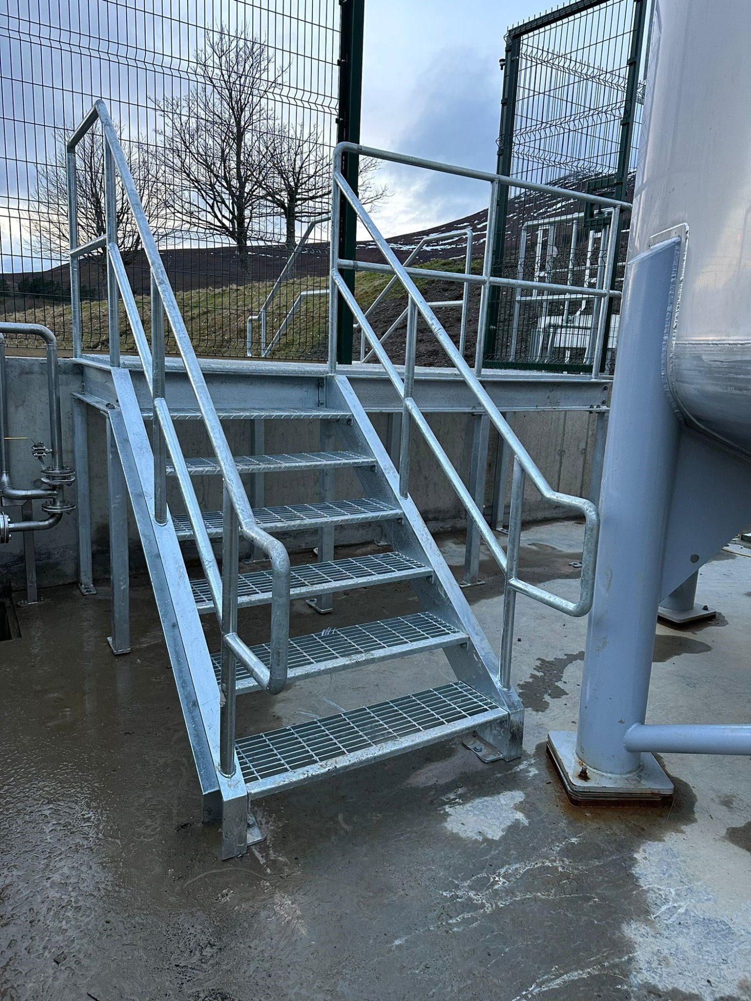 Small access stair over a bund wall.