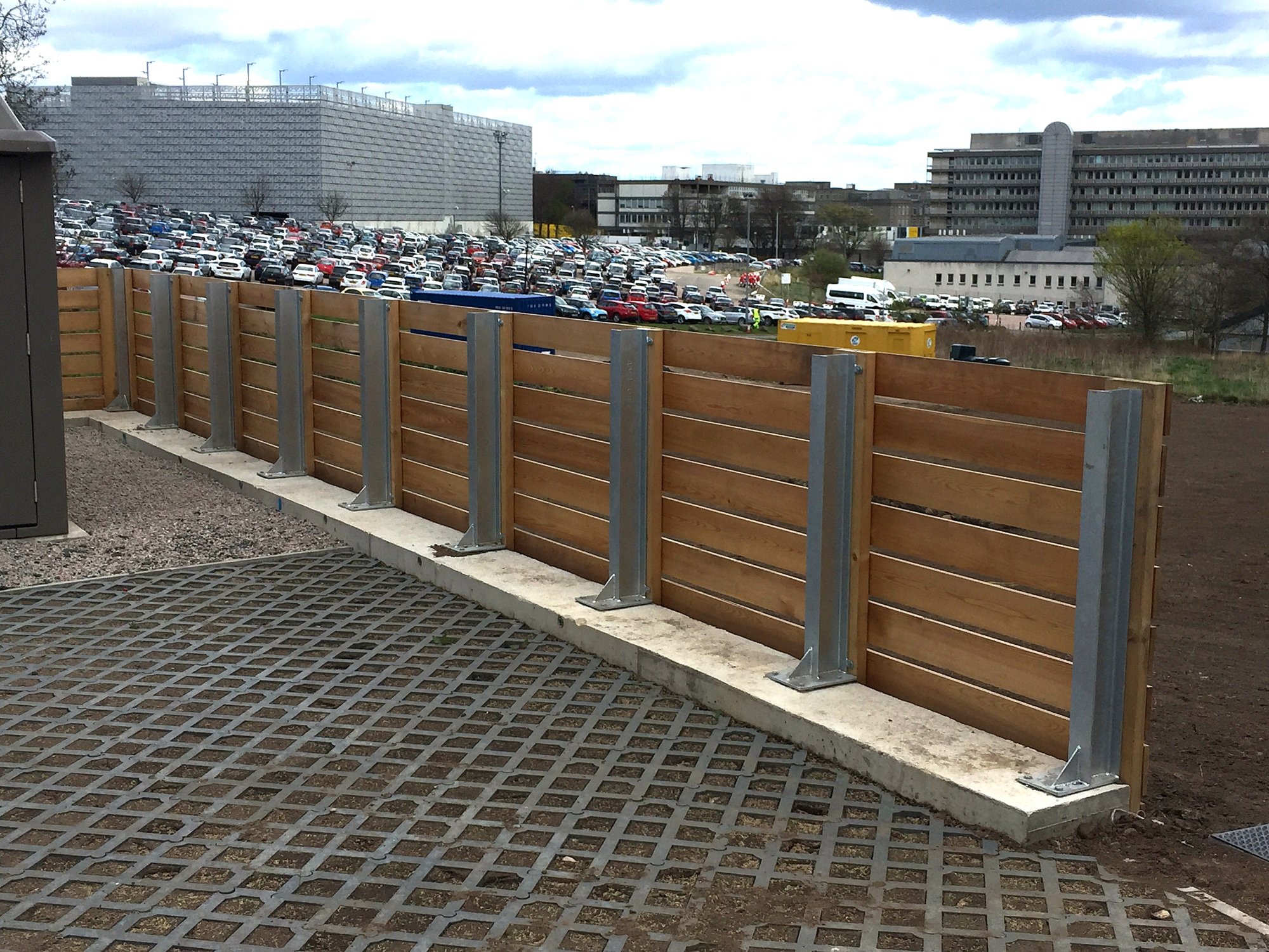1200mm high fencing on galvanised UB posts baseplated and fixed to the concrete retaining wall.